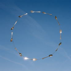 The Spoons&nbsp;is a photographic work of spoons in a circular formation against a blue sky.&nbsp;